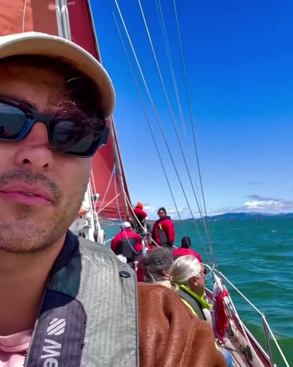 Sailing under red sails on San Francisco Bay