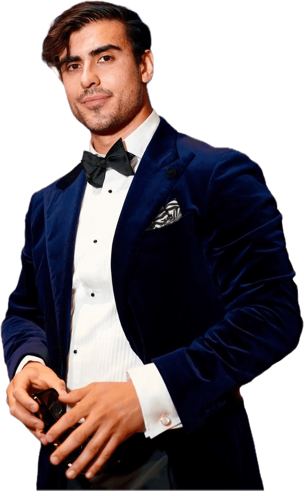 An Insta GQ client in a velvet tuxedo, cut out against the dark panel